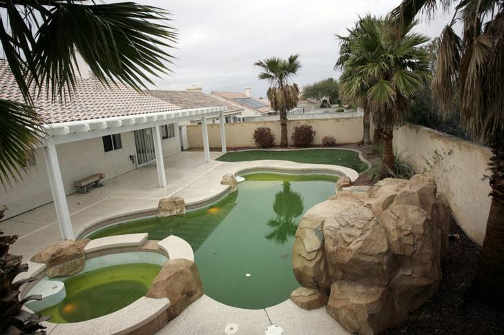 A stagnant pool is shown in Ventana Canyon in Henderson, whose homeowners association was sued by investors. 
