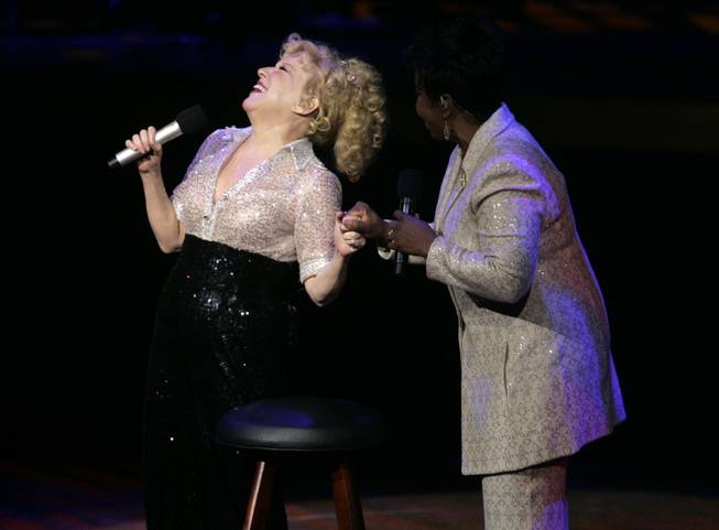 Bette Midler laughs with surprise guest Gadys Knight during the final show of "The Showgirl Must Go On" at Caesars Palace Sunday, January 31, 2010.