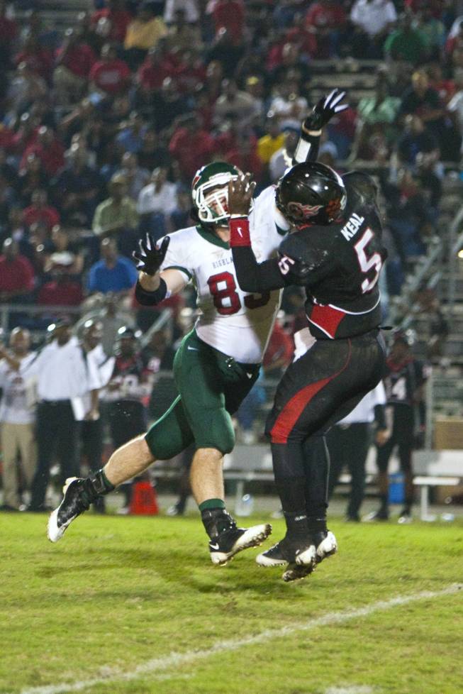 Perry Cooper, a linebacker at The Woodlands High in Texas, pressures the quarterback during a game this fall. Cooper is expected to sign a letter of intent with UNLV on Wednesday, one of four prospects from Texas.