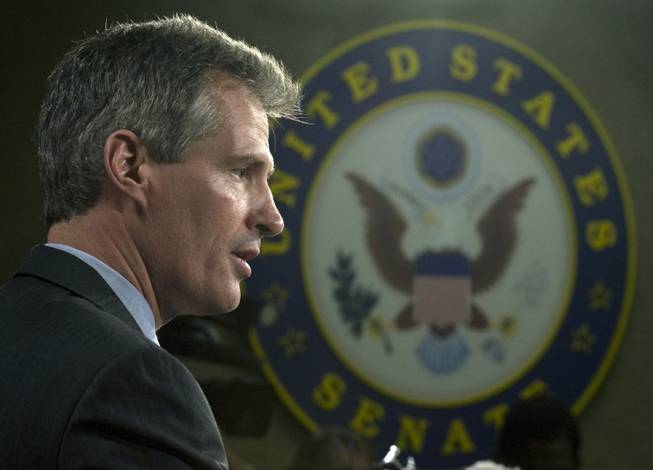 Sen. Scott Brown, R-Mass., speaks with reporters on Capitol Hill in Washington on Thursday following his swearing in.