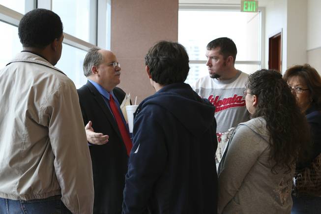 Chief Deputy District Attorney Bruce Nelson speaks with the victims' family following the bail hearing for Nathan Hardy on Feb. 5 at the Regional Justice Center. Hardy is accused in a Jan. 29 crash that killed Maria DelCarmen Lewis, 45, and her son, Daniel Santos, 17, a student at Canyon Springs High.