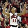 UNLV guard Tre'Von Willis signals another 3-point shot during the first half of their game against BYU Saturday, Feb. 6, 2010.