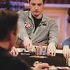 Tom "durrrr" Dwan tosses chips into a pot during a filming of High Stakes Poker at the Golden Nugget.