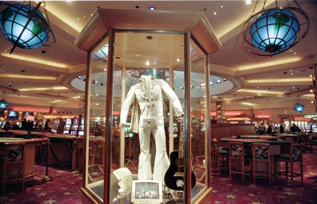 An outfit worn by Elvis Presley heralds the way to the Center Bar in the Hard Rock Hotel, Monday, Nov. 30, 1998.