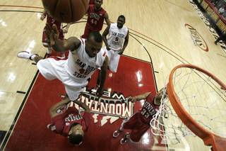 UNLV guard Anthony Marshall draws a charge from San Diego State guard Kelvin Davis during the first half of their Mountain West Conference game Saturday, Feb. 13, 2010 at Viejas Arena in San Diego. San Diego State won the game 68-58.
