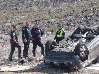 Henderson Police investigate a fatal two-vehicle crash on West Horizon Ridge Parkway Tuesday.