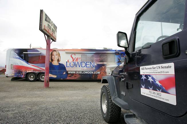 Sue Lowden's bus and Bill Parson's Jeep are seen outside the Hide-A-Way Steak House in Battle Mountain during a swing through Northern Nevada on the Lincoln Day dinner circuit Saturday, Feb. 20, 2010.