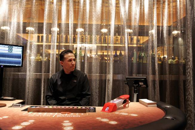 Dealer Joe Carrion waits inside the high-limit baccarat room in January at the Hard Rock Hotel.