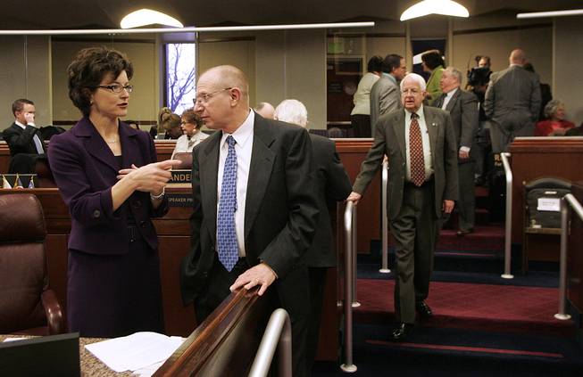 Assembly Minority Leader Heidi Gansert talks with Assemblyman Joe Hardy before the start of the first day of the legislative special session Tuesday, February 23, 2010 in Carson City.