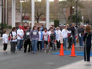 Participants prepare to begin the one-mile walk portion of the Henderson Libraries Read and Run Saturday on Water Street.