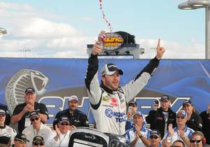 Jimmie Johnson celebrates his victory in the NASCAR Shelby American GT 350 at Las Vegas Motor Speedway on Feb. 28, 2010.