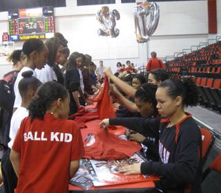 The UNLV Lady Rebels sign autographs for fans after a game Saturday, Feb. 27, 2010, against Air Force.