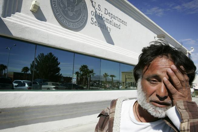 Jamshid Afshar stands in front of the the Las Vegas U.S. Citizenship and Immigration Services offices after failing to receive paperwork requested from the DMV so he can get a government-issued ID card, a necessity for work. Afshar and Hossein had to make an appointment to come back to the offices to get the paperwork.