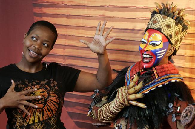 Buyi Zama, who plays Rafiki in The Lion King at Mandalay Bay, stands next to the wax figure of the Rafiki character during it's unveiling at Madame Tussauds Las Vegas Thursday, March 4, 2010.