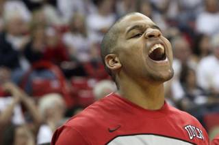 UNLV guard Steve Jones cheers from the bench during the game Saturday against Wyoming at the Thomas & Mack Center. UNLV closed the regular season with a 74-56 win.