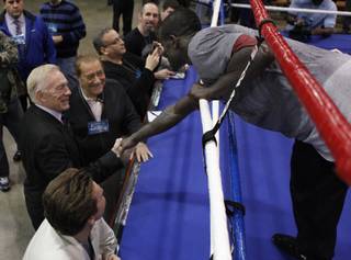 Joshua Clottey meets with Bob Arum and Jerry Jones at the Gaylord Texan Hotel in Dallas, Texas on March 8, 2010. Clottey is preparing for a welterweight fight with Manny Pacquaio at Dallas Cowboys Stadium in March 13, 2010.
