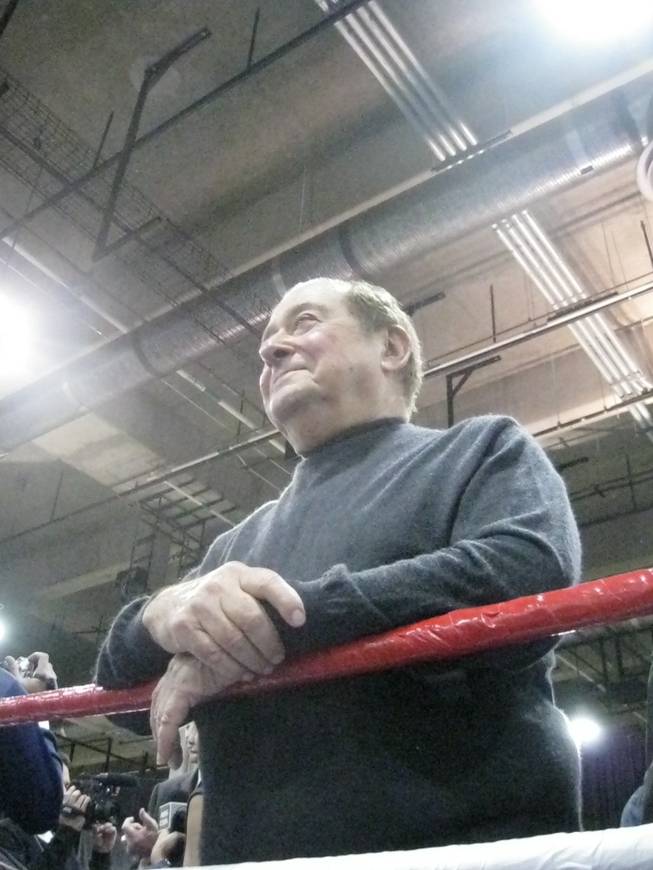 Bob Arum, in the ring, grinning at the spectacle.