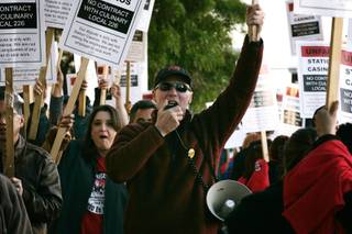 Culinary Union Secretary-Treasurer D. Taylor leads a chant during a  rally and picket line organized by the Culinary Union Local 226 to condemn Station Casinos' anti-union campaigns in front of Palace Station in Las Vegas Thursday, March 11, 2010.