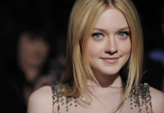 Dakota Fanning, a cast member in "The Runaways," poses at the premiere of the film "The Runaways" in Los Angeles, Thursday, March 11, 2010. 