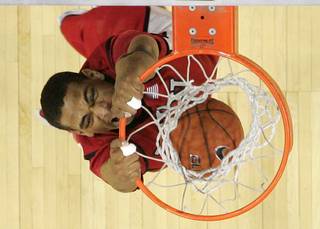 UNLV guard Anthony Marshall dunks against BYU during Friday's Mountain West Conference Tournament game. UNLV upset the No. 2-seeded Cougars 70-66 and will face San Diego State in the championship.