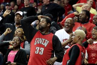 UNLV fans cheer during the Rebels 73-61 victory against Utah on Thursday in the Mountain West Conference quarterfinals at the Thomas & Mack Center.