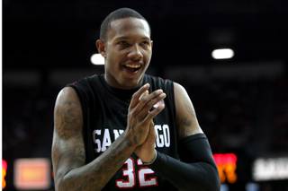 Billy White of San Diego State claps during the game against New Mexico during Friday's Mountain West Conference Tournament game. San Diego St. will advance to the final with a 72-69 win.