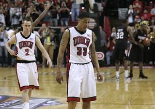 UNLV guards Tre'Von Willis and Kendall Wallace walk off the court after their Mountain West Conference championship game Saturday, March 13, 2010, against San Diego State University.
