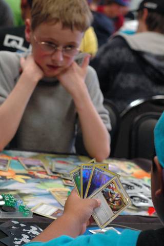 Ryan Hines waits for his opponent to make a move during the junior division championship round of the Pokemon Trading Card Game Nevada State Championship.