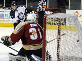 Mick Lawrence buries a one-timer past Condors goaltender Tyler Sims during the second period of play at the Orleans Arena on Saturday night.