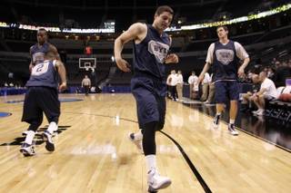 BYU guard Jimmer Fredette runs a drill with teammates during practice for the first round of the NCAA Basketball Championships Wednesday, March 17, 2010 at the Ford Center in Oklahoma Ctiy.
