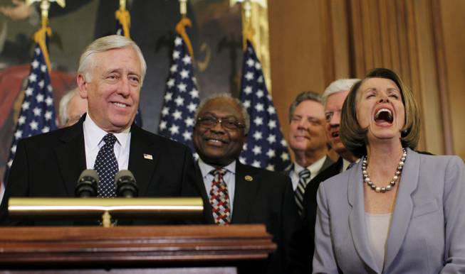 Speaker Nancy Pelosi of California laughs as Majority Leader Steny Hoyer of Maryland speaks during a press conference after the House passed health care reform in the U.S. Capitol in Washington, Sunday, March 21, 2010. 