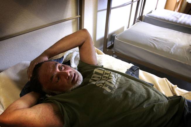 Jamshid Afshar finds rest for the night in his bunk at Catholic Charities of Southern Nevada's shelter just north of downtown Las Vegas. The shelter is only a few hundred feet away from where Afshar slept on the street.