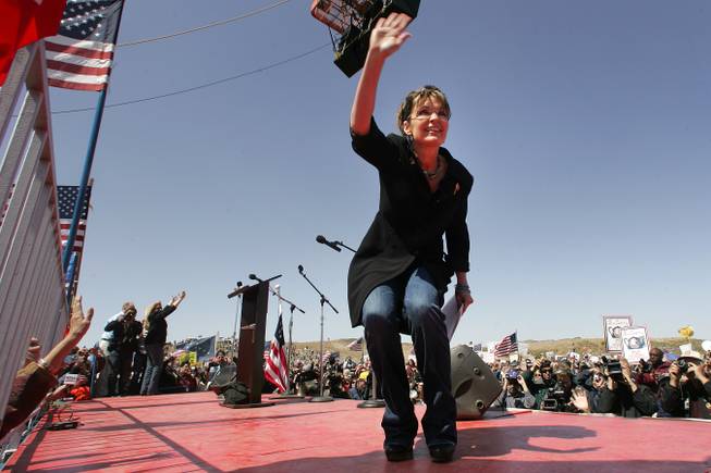 Sarah Palin waves to her fans at the "Showdown in Searchlight" Tea Party Express rally just outside Searchlight on Saturday, March 27, 2010.
