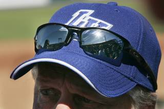 Reporters are reflected in manager Dan Rohn's sunglasses during media day for the 51's Tuesday, April 6, 2010 at Cashman Field.