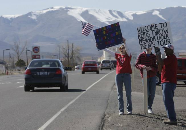 Protesters picket outside TJ's Pizza Shack in Fernley as Senate Majority Leader Harry Reid (D-Nev.) makes a campaign stop Tuesday, April 6, 2010. 