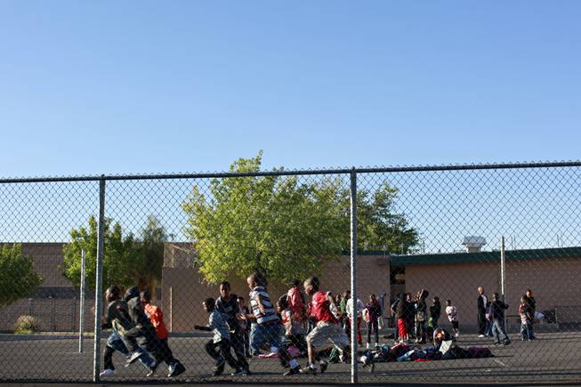 Students play while waiting for school to start at Kit Carson Elementary in Las Vegas on Wednesday, April 7, 2010.  