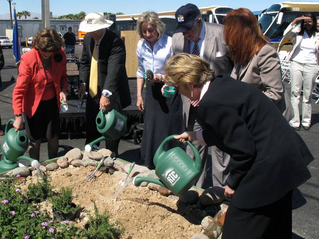 From left, Rep. Shelley Berkley, RTC General Manager Jacob Snow, Rep. Dina Titus, Las Vegas Mayor Oscar Goodman, Henderson City Councilwoman Debra March and County Commissioner Chris Giunchigliani plant seeds to mark the stat of work on the ACE Green Line.
