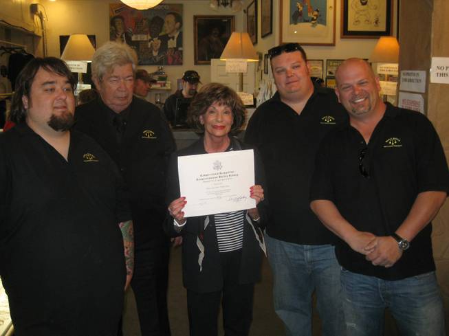 Shelley Berkley with her (unframed) proclamation, surrounded by "Pawn Stars" Austin "Chumlee" Russell, Corey "Big Hoss" Harrison, Rick "Old Man" Harrison and Rick "The Spotter" Harrison. 