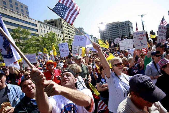 People attend a Tea Party protest in Washington, Thursday, April 15, 2010.