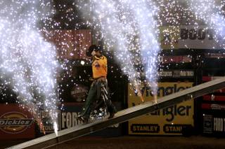 A member of the Australian team makes his entrance during the first round of the PBR World Cup on Friday, at the Thomas & Mack Center. Team Brazil finished the night in first place with a score of 354.25.
