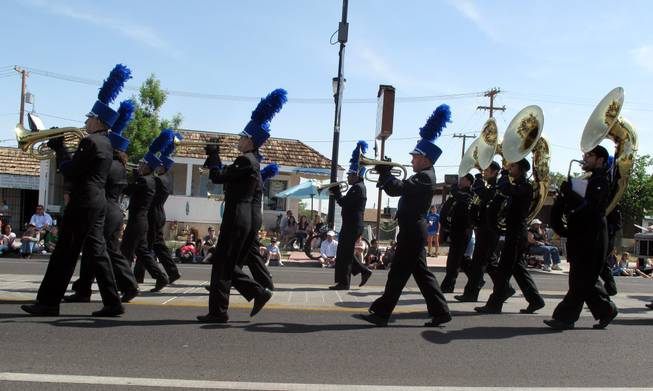 Members of the Basic High School Marching Band play Saturday during the Henderson Heritage Parade.