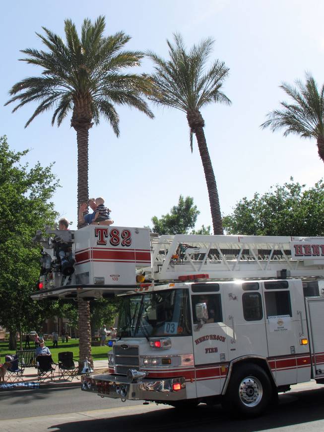 A fire truck makes its way down Water Street on Saturday during the Henderson Heritage Parade.