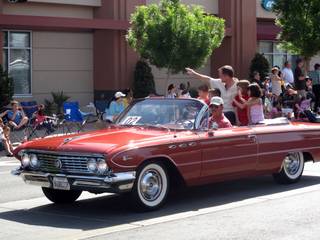 UNLV basketball coach Lon Kruger waves to spectators while serving as the grand marshal of the Henderson Heritage Parade.