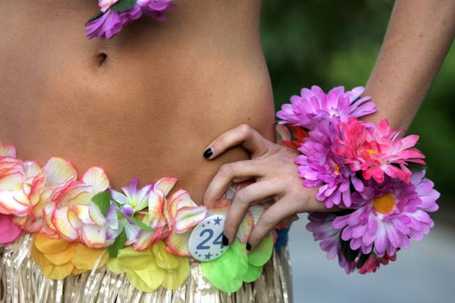 A contestant in the International Bikini Team Aloha State Finals poses for the Hawaiian-style portion of the competition Friday at the Silverton.