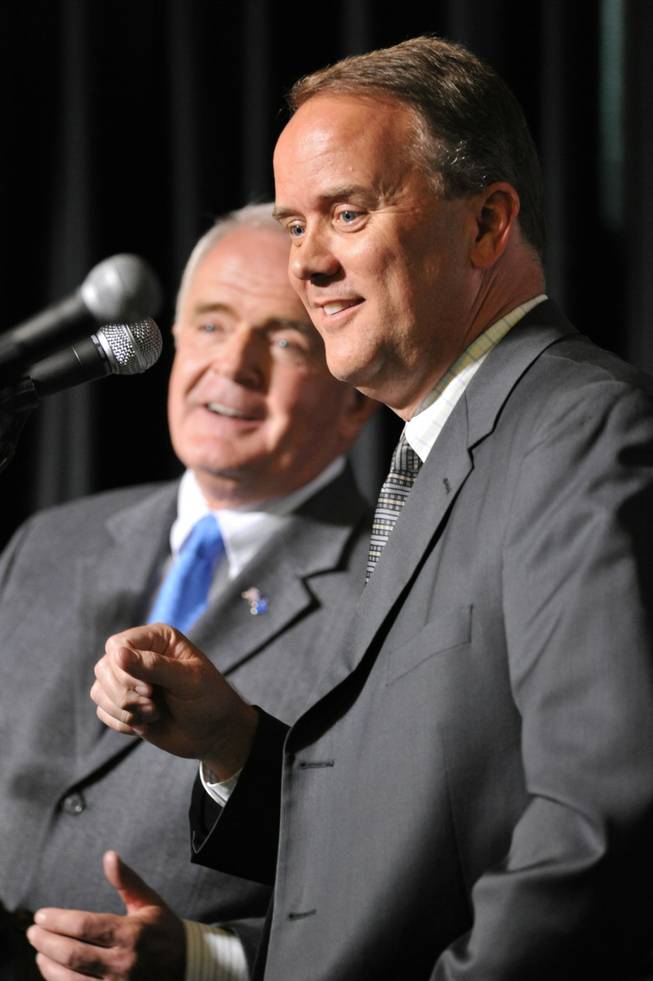 Republican candidate for governor Mike Montandon, right, and Gov. Jim Gibbons share some light banter during the Republican gubernatorial debate in Reno on Friday, April 23, 2010. 