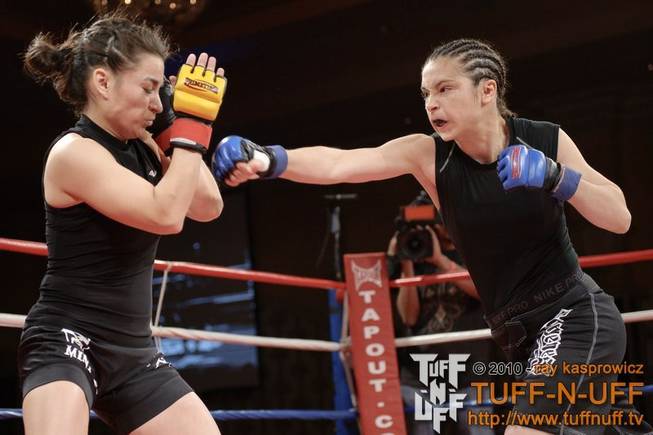 Ashley Cummins strikes Cathy Snell during the Tuff-N-UFF Amateur Fighting Championships at The Orleans on April 23, 2010. Cumins won the fight via unanimous decision.