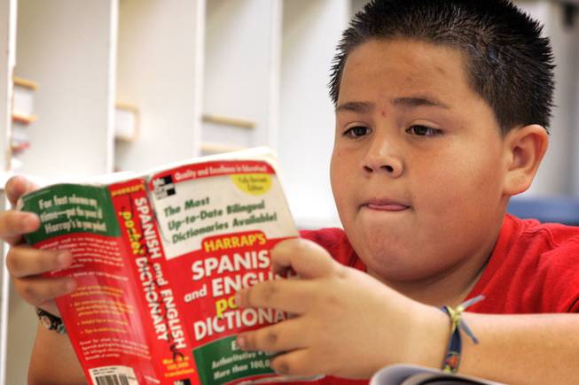 Fifth grader Juan Guillen reads his Spanish-English dictionary while taking the CRT reading test at Herron Elementary School in North Las Vegas Tuesday, April 27, 2010.