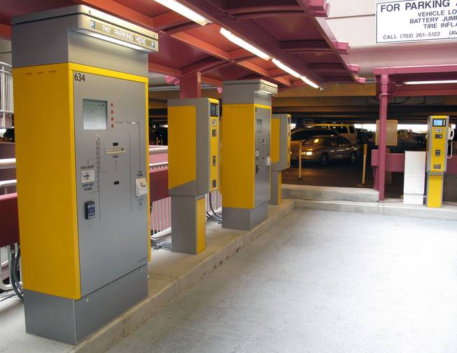 New Express Exit walk-up pay stations line the area between the passenger pickup area and the parking lot elevators at McCarran International Airport.