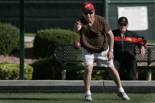 Joel Holzman lets loose with a ball while playing bocce ball on the Sun City Anthem courts Wednesday, April 28, 2010.