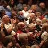 Members of the audience applaud Friday during a Republican debate sponsored by conservative talk radio station KDWN.